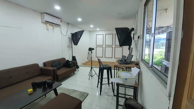 Professional photo studio interior with softbox lighting and camera equipment